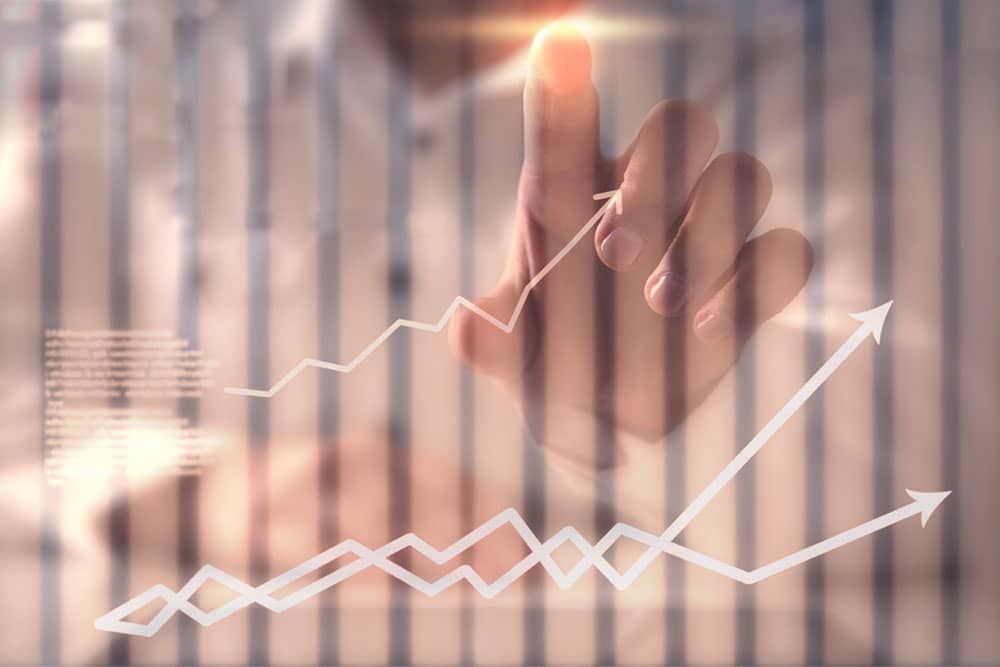 hand pointing at Copper-Toned Ascending Line Chart